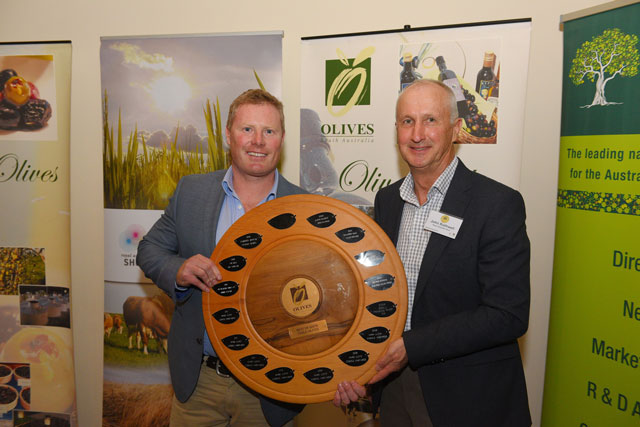 Ed Vercoe received the Best Table Olive of Show award from Royal Adelaide Show Society director John Rothwell. Image by Festival City Photography